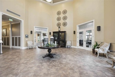 Discover refined Florida living at 23619 Awabuki Drive in the on Sarasota National Golf Club in Florida - for sale on GolfHomes.com, golf home, golf lot