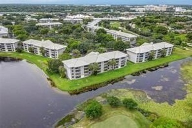 Lakefront Golf Course Condo. Move-in ready and beautifully on Pine Island Ridge Country Club in Florida - for sale on GolfHomes.com, golf home, golf lot