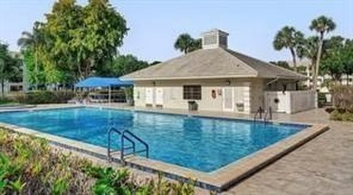 Lakefront Golf Course Condo. Move-in ready and beautifully on Pine Island Ridge Country Club in Florida - for sale on GolfHomes.com, golf home, golf lot