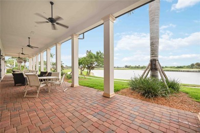 Discover refined Florida living at 23619 Awabuki Drive in the on Sarasota National Golf Club in Florida - for sale on GolfHomes.com, golf home, golf lot