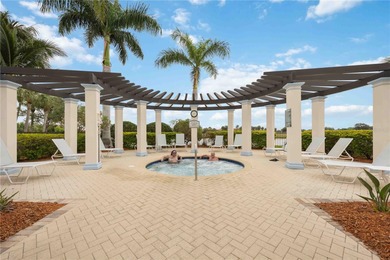 Discover refined Florida living at 23619 Awabuki Drive in the on Sarasota National Golf Club in Florida - for sale on GolfHomes.com, golf home, golf lot