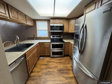 Welcome home to this thoughtfully updated tri-level townhouse on Riverton Country Club in Wyoming - for sale on GolfHomes.com, golf home, golf lot