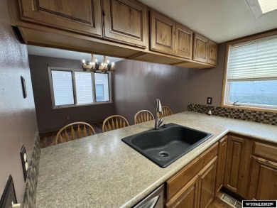 Welcome home to this thoughtfully updated tri-level townhouse on Riverton Country Club in Wyoming - for sale on GolfHomes.com, golf home, golf lot