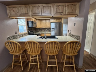 Welcome home to this thoughtfully updated tri-level townhouse on Riverton Country Club in Wyoming - for sale on GolfHomes.com, golf home, golf lot