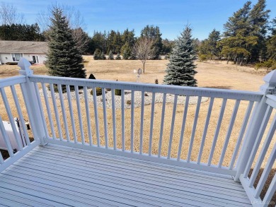 Escape the hassle of lawn care and snow removal while still on Terrace Bluff Golf Course in Michigan - for sale on GolfHomes.com, golf home, golf lot