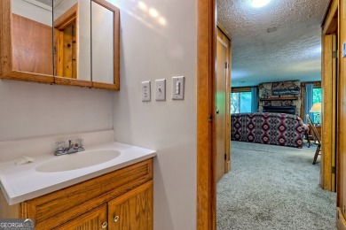 Tucked in Sky Valley's golf community, this tiny treehouse on Sky Valley Resort and Country Club in Georgia - for sale on GolfHomes.com, golf home, golf lot