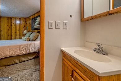 Tucked in Sky Valley's golf community, this tiny treehouse on Sky Valley Resort and Country Club in Georgia - for sale on GolfHomes.com, golf home, golf lot