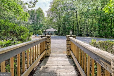 Tucked in Sky Valley's golf community, this tiny treehouse on Sky Valley Resort and Country Club in Georgia - for sale on GolfHomes.com, golf home, golf lot