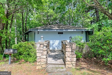 Tucked in Sky Valley's golf community, this tiny treehouse on Sky Valley Resort and Country Club in Georgia - for sale on GolfHomes.com, golf home, golf lot