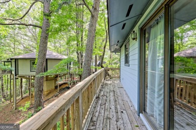 Tucked in Sky Valley's golf community, this tiny treehouse on Sky Valley Resort and Country Club in Georgia - for sale on GolfHomes.com, golf home, golf lot