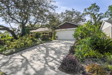 Welcome to this beautifully landscaped corner lot home located on Beacon Woods Golf Club in Florida - for sale on GolfHomes.com, golf home, golf lot