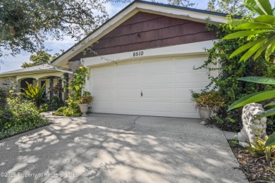 Welcome to this beautifully landscaped corner lot home located on Beacon Woods Golf Club in Florida - for sale on GolfHomes.com, golf home, golf lot