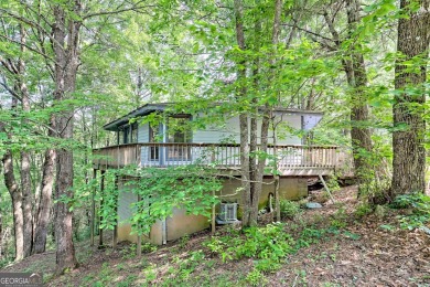 Tucked in Sky Valley's golf community, this tiny treehouse on Sky Valley Resort and Country Club in Georgia - for sale on GolfHomes.com, golf home, golf lot