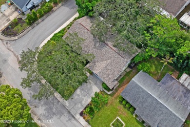 Welcome to this beautifully landscaped corner lot home located on Beacon Woods Golf Club in Florida - for sale on GolfHomes.com, golf home, golf lot