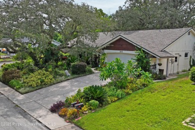 Welcome to this beautifully landscaped corner lot home located on Beacon Woods Golf Club in Florida - for sale on GolfHomes.com, golf home, golf lot
