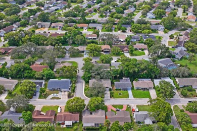 Welcome to this beautifully landscaped corner lot home located on Beacon Woods Golf Club in Florida - for sale on GolfHomes.com, golf home, golf lot