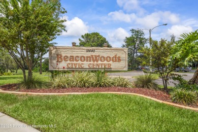 Welcome to this beautifully landscaped corner lot home located on Beacon Woods Golf Club in Florida - for sale on GolfHomes.com, golf home, golf lot