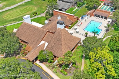 Welcome to this beautifully landscaped corner lot home located on Beacon Woods Golf Club in Florida - for sale on GolfHomes.com, golf home, golf lot