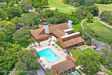 Welcome to this beautifully landscaped corner lot home located on Beacon Woods Golf Club in Florida - for sale on GolfHomes.com, golf home, golf lot