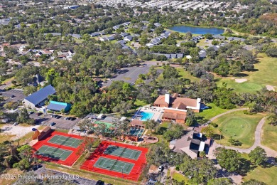 Welcome to this beautifully landscaped corner lot home located on Beacon Woods Golf Club in Florida - for sale on GolfHomes.com, golf home, golf lot