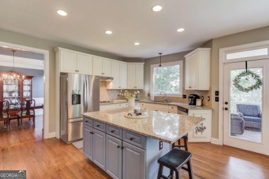 Welcome to this stunning 6 bedroom, 4 bath lakefront home in on Hamilton Mill Golf Club in Georgia - for sale on GolfHomes.com, golf home, golf lot