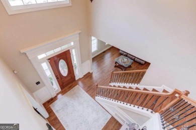 Welcome to this stunning 6 bedroom, 4 bath lakefront home in on Hamilton Mill Golf Club in Georgia - for sale on GolfHomes.com, golf home, golf lot