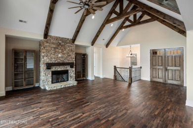 Step into luxury with this custom-built home nestled on the on Wind River Golf Course in Tennessee - for sale on GolfHomes.com, golf home, golf lot