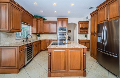 One or more photo(s) has been virtually staged. Nestled within on The Eagles Golf Course and Club in Florida - for sale on GolfHomes.com, golf home, golf lot