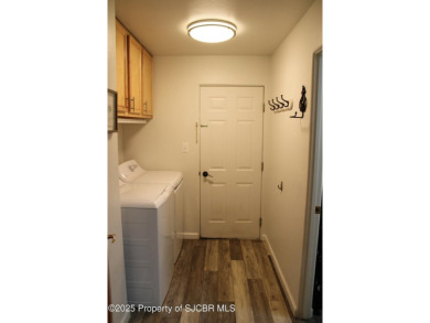 This cozy home features vaulted ceilings, a fireplace, and a 2 on San Juan Country Club in New Mexico - for sale on GolfHomes.com, golf home, golf lot