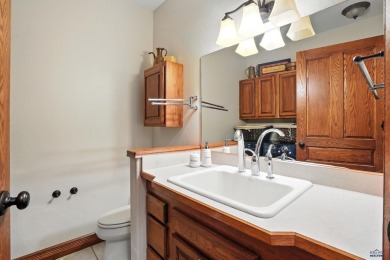Beautiful custom built, executive home in coveted Enchanted on Arrowhead Country Club in South Dakota - for sale on GolfHomes.com, golf home, golf lot