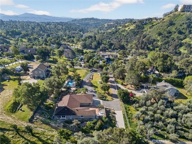 Set on 1.33 acres along a private road in a small community on Pala Mesa Resort in California - for sale on GolfHomes.com, golf home, golf lot