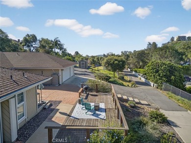 Set on 1.33 acres along a private road in a small community on Pala Mesa Resort in California - for sale on GolfHomes.com, golf home, golf lot