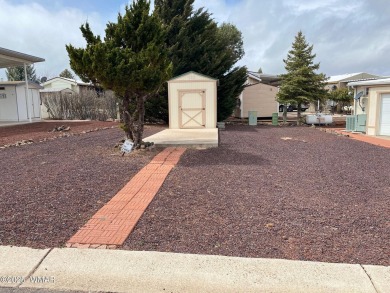 RV Lot with small shed and partial view of the Golf Course on Juniper Ridge R.V. Golf Resort in Arizona - for sale on GolfHomes.com, golf home, golf lot