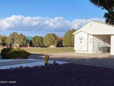 RV Lot with small shed and partial view of the Golf Course on Juniper Ridge R.V. Golf Resort in Arizona - for sale on GolfHomes.com, golf home, golf lot