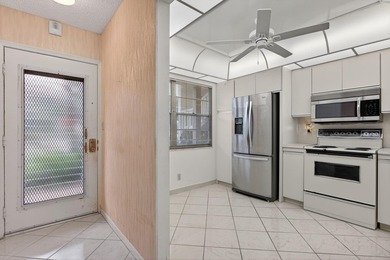 ASSOC REQUIRES 15% DOWN & 1 OCCUP 55+ VACANT/CLICK ON SHOWING on Wynmoor Golf Course in Florida - for sale on GolfHomes.com, golf home, golf lot