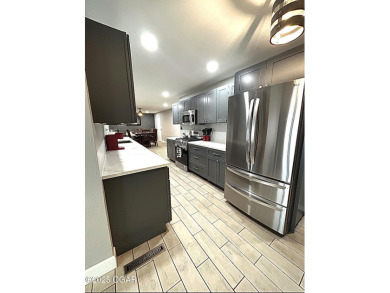 Completely remodeled golf course home offering 2,147 sq. ft. of on Baxter Country Club in Kansas - for sale on GolfHomes.com, golf home, golf lot