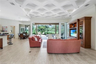 Immerse yourself in the ultimate expression of luxury living at on Shadow Wood Country Club in Florida - for sale on GolfHomes.com, golf home, golf lot