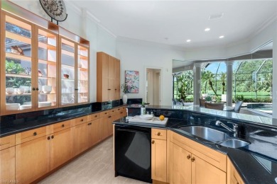 Immerse yourself in the ultimate expression of luxury living at on Shadow Wood Country Club in Florida - for sale on GolfHomes.com, golf home, golf lot