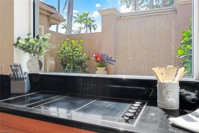 Immerse yourself in the ultimate expression of luxury living at on Shadow Wood Country Club in Florida - for sale on GolfHomes.com, golf home, golf lot