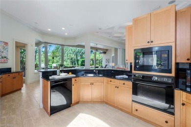 Immerse yourself in the ultimate expression of luxury living at on Shadow Wood Country Club in Florida - for sale on GolfHomes.com, golf home, golf lot