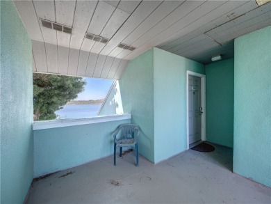 Experience waterfront living in this 3-bedroom, 2-bathroom condo on Padre Isles Golf Course in Texas - for sale on GolfHomes.com, golf home, golf lot