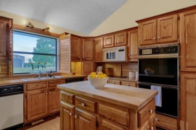 Discover serenity in this custom Stone home situated on over 1.2 on Denison Country Club in Texas - for sale on GolfHomes.com, golf home, golf lot