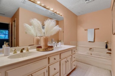 Discover serenity in this custom Stone home situated on over 1.2 on Denison Country Club in Texas - for sale on GolfHomes.com, golf home, golf lot