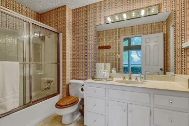 Discover serenity in this custom Stone home situated on over 1.2 on Denison Country Club in Texas - for sale on GolfHomes.com, golf home, golf lot