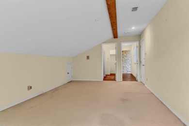 Discover serenity in this custom Stone home situated on over 1.2 on Denison Country Club in Texas - for sale on GolfHomes.com, golf home, golf lot