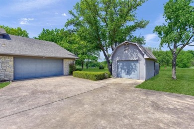 Discover serenity in this custom Stone home situated on over 1.2 on Denison Country Club in Texas - for sale on GolfHomes.com, golf home, golf lot