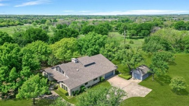 Discover serenity in this custom Stone home situated on over 1.2 on Denison Country Club in Texas - for sale on GolfHomes.com, golf home, golf lot