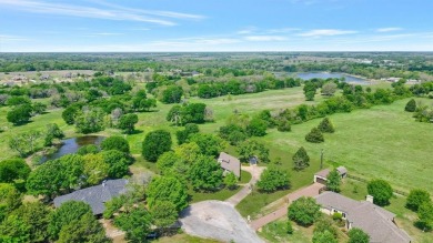 Discover serenity in this custom Stone home situated on over 1.2 on Denison Country Club in Texas - for sale on GolfHomes.com, golf home, golf lot