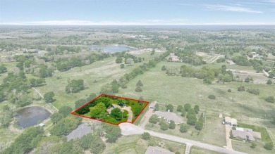 Discover serenity in this custom Stone home situated on over 1.2 on Denison Country Club in Texas - for sale on GolfHomes.com, golf home, golf lot