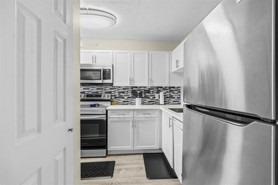 Discover this beautifully updated first-floor 2/2 condo offering on Pine Island Ridge Country Club in Florida - for sale on GolfHomes.com, golf home, golf lot